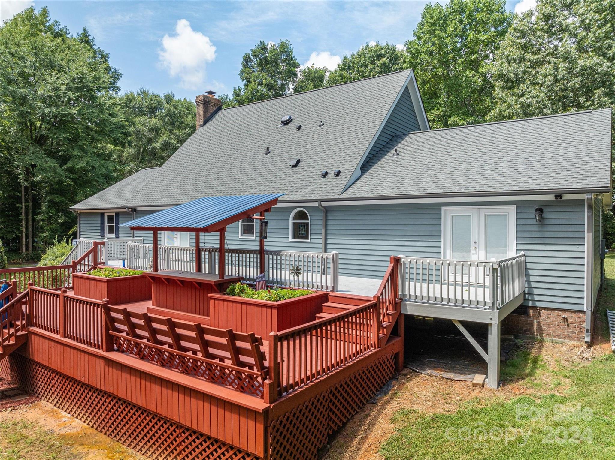459 Patrick Road Gastonia, NC 28056 - Photo 31 of 39 an outdoor view of house with swimming pool and deck