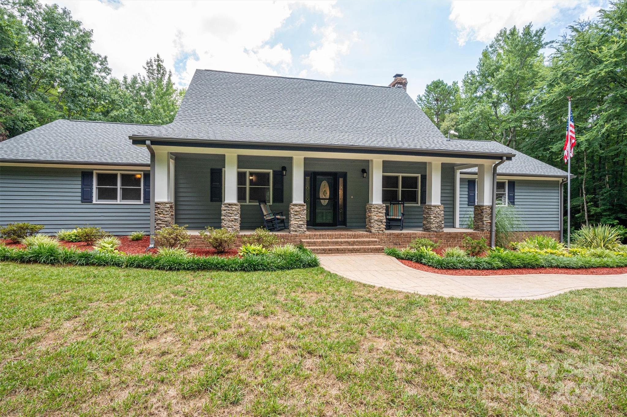 459 Patrick Road Gastonia, NC 28056 - Photo 8 of 39 a view of a house with a yard and plants