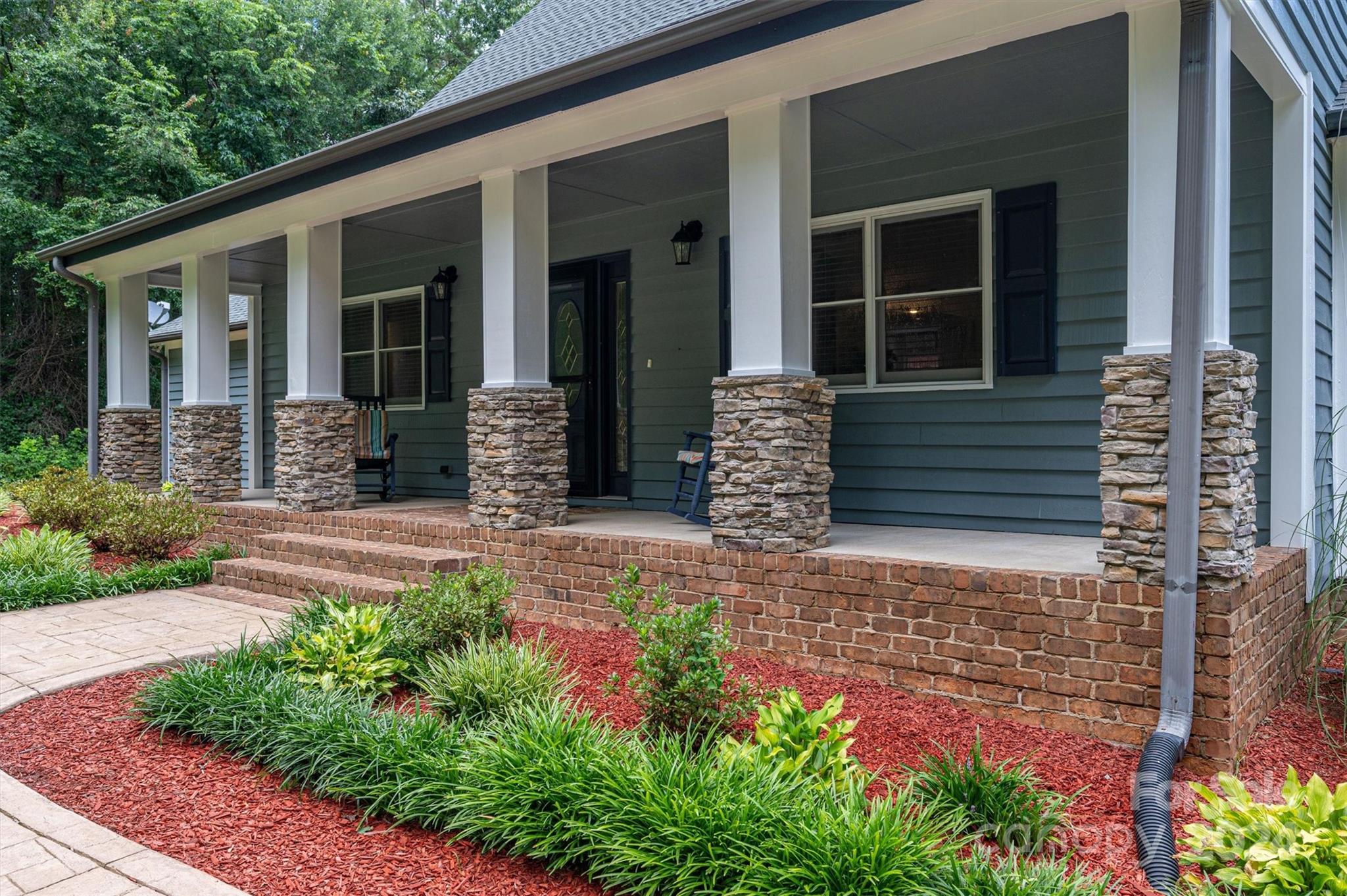 459 Patrick Road Gastonia, NC 28056 - Photo 10 of 39 front view of a house with potted plants