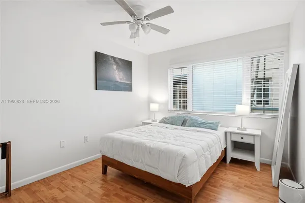 a bedroom with a bed and a table