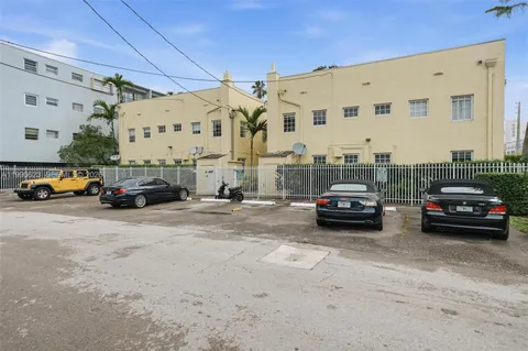 a view of parking with cars parked
