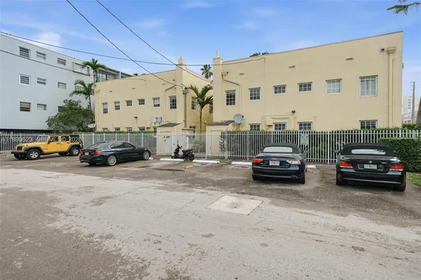 a view of parking with cars parked