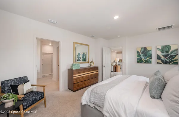 a bathroom with a bathtub sink and mirror
