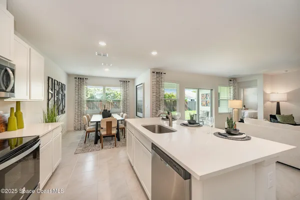 a kitchen with a table and chairs in it