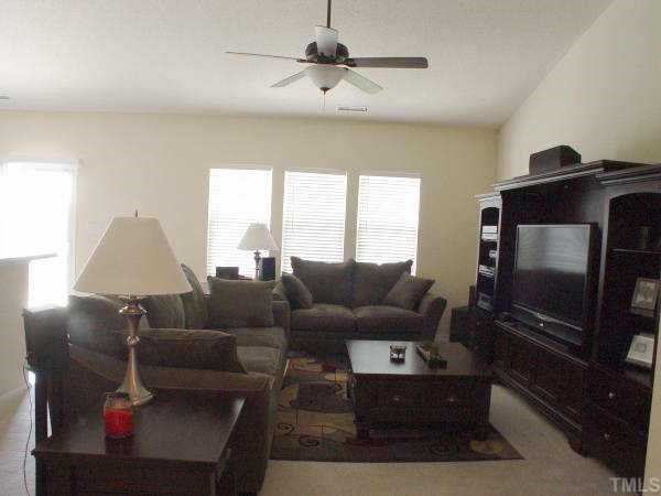 5516 Enoree Lane Raleigh, NC 27616 - Photo 3 of 9 Open family room with cozy corner fireplace