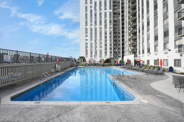 a view of swimming pool with outdoor seating