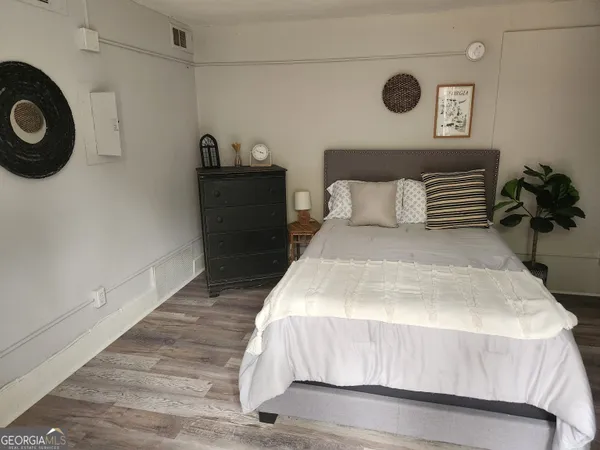 a bedroom with a bed and a cabinets