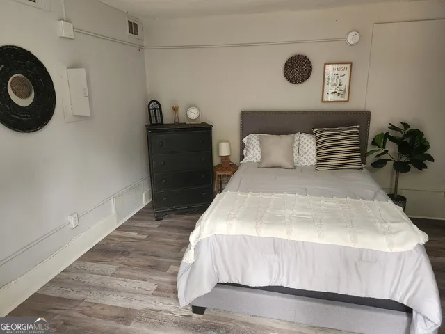 a bedroom with a bed and a cabinets
