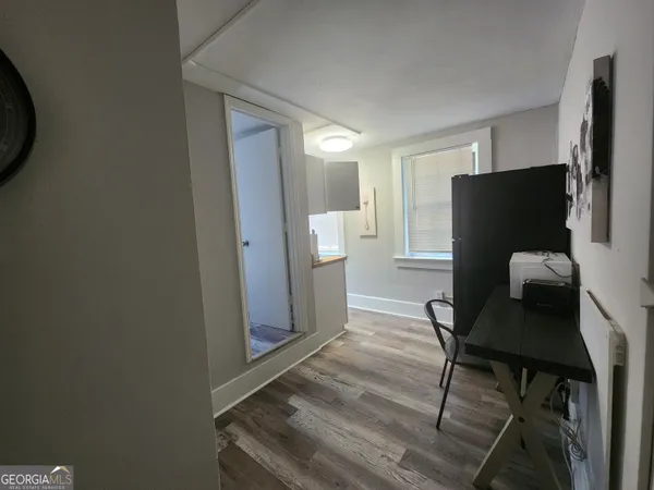 a view of a livingroom with furniture and a window