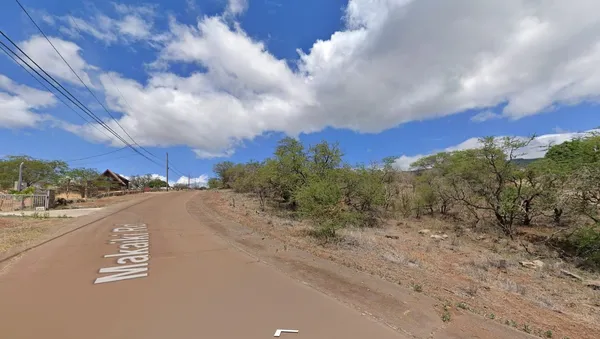 a view of a city street with a building