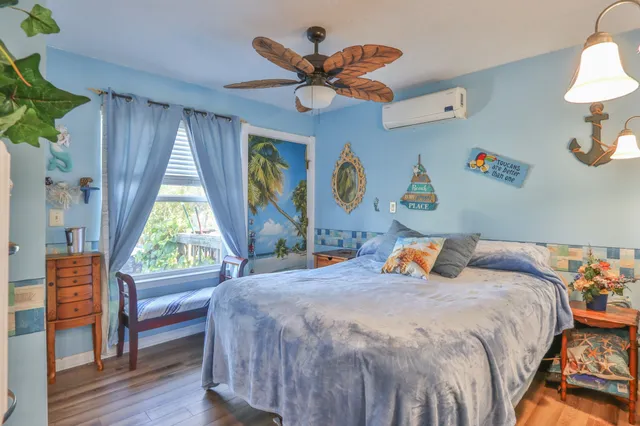 a bedroom with a bed and a table