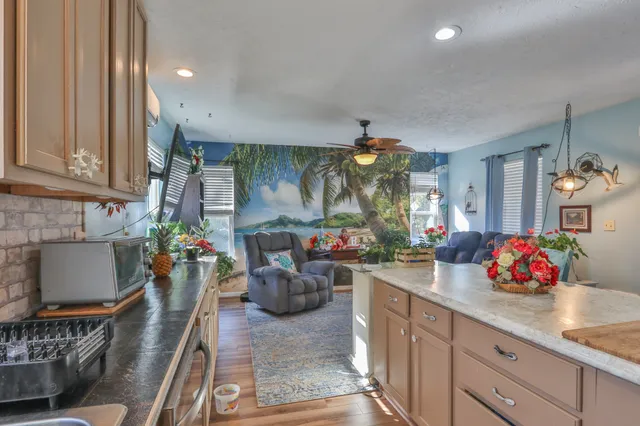a kitchen filled with a white stove and cabinets