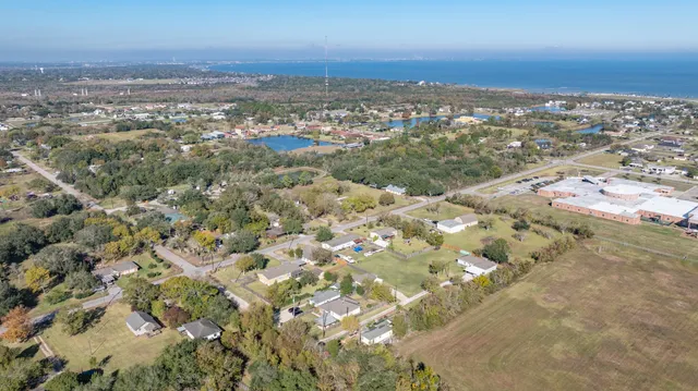 an aerial view of residential building with an outdoor space