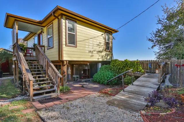 a front view of a house with stairs