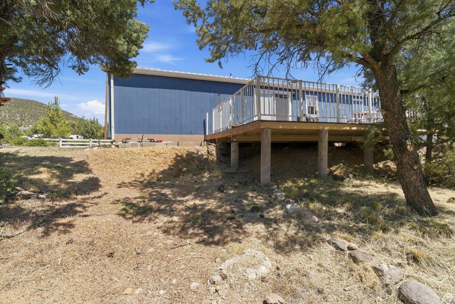 327 North Lodge Road Central, UT 84722 - Photo 26 of 45 Elevated wood deck with white railing, supported by concrete pillars