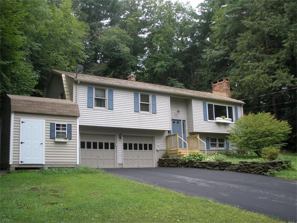 15 Old Stage Road Hatfield, MA 01088 - Photo 1 of 16 a front view of a house with a garden