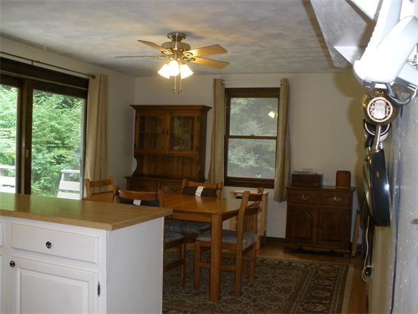 15 Old Stage Road Hatfield, MA 01088 - Photo 11 of 16 a room with two chandeliers and furniture