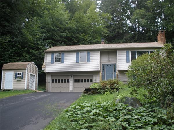 15 Old Stage Road Hatfield, MA 01088 - Photo 3 of 16 a view of a white house with large windows and a small yard