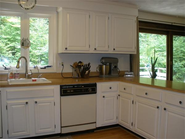15 Old Stage Road Hatfield, MA 01088 - Photo 9 of 16 a kitchen with white cabinets and a window