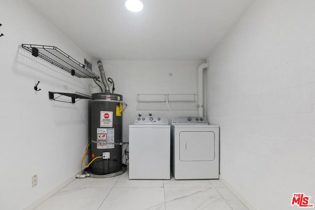 29239 Heathercliff Road, Unit 12 Malibu, CA 90265 - Photo 31 of 32 a utility room with dryer and washer