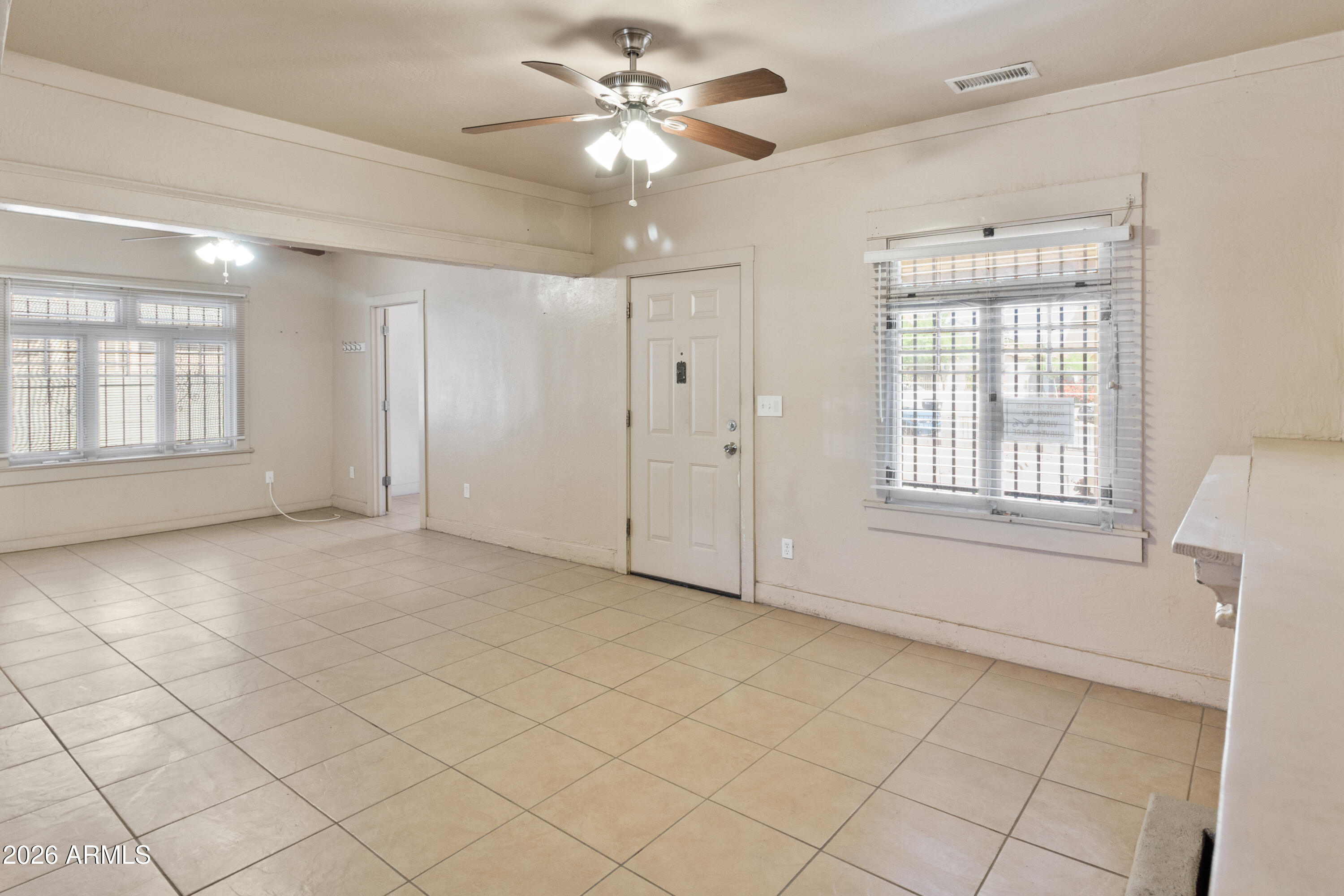 1237 East Pierce Street Phoenix, AZ 85006 - Photo 8 of 23 a view of an empty room with a window