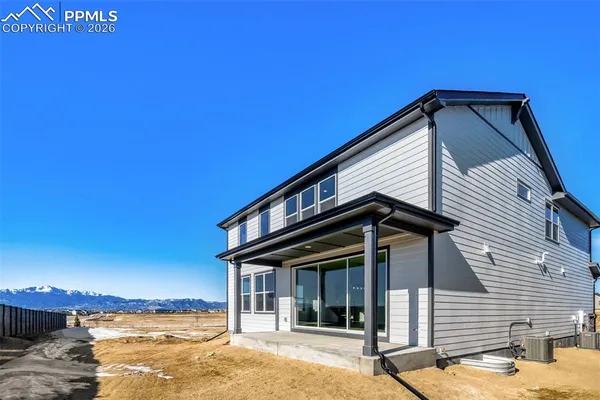 a front view of a house with a ocean view