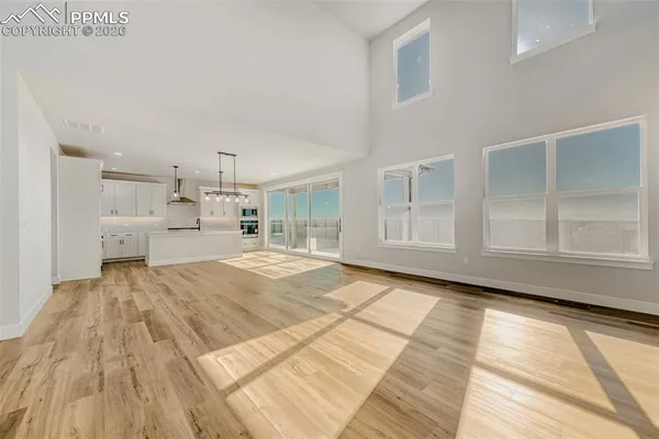 a spacious bedroom with a large bed and a window