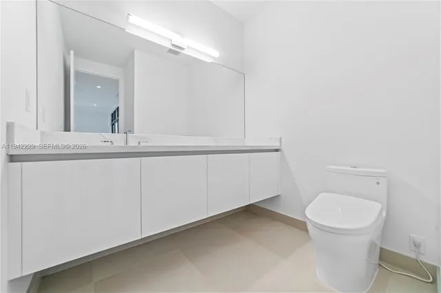 a spacious bathroom with a bathtub shower sink and mirror