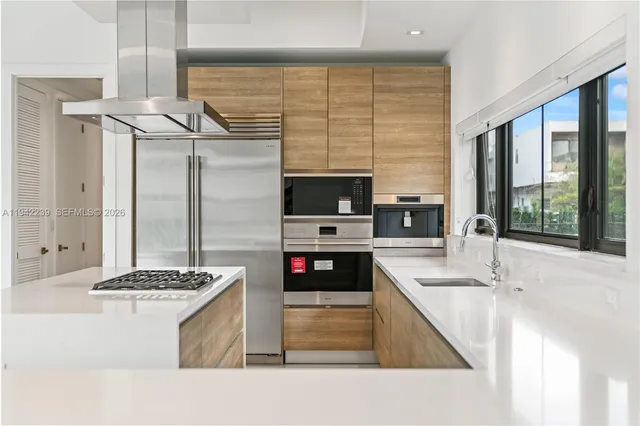 a bathroom with a granite countertop sink a toilet and shower