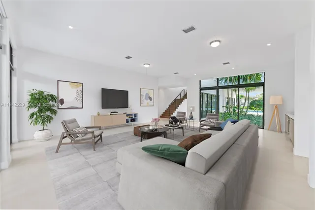 a view of an empty room with glass door