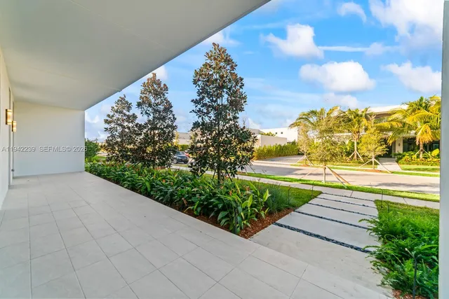 a kitchen with kitchen island stainless steel appliances a counter top space and cabinets