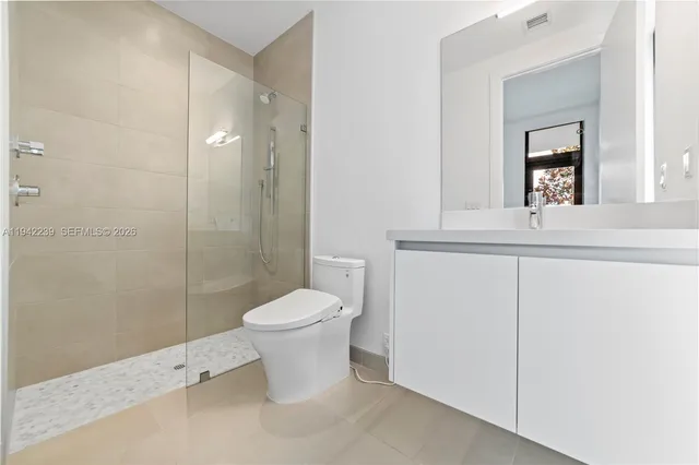 a view of a garden with a building in the background