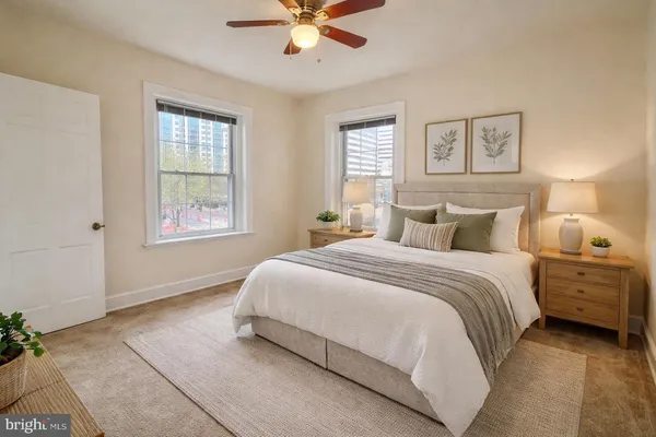 a bedroom with a bed and window
