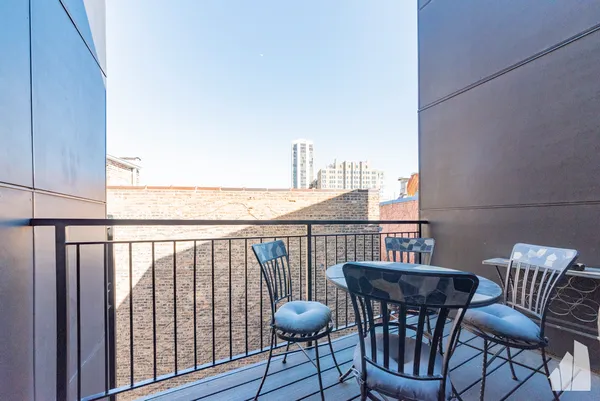 a view of balcony with furniture