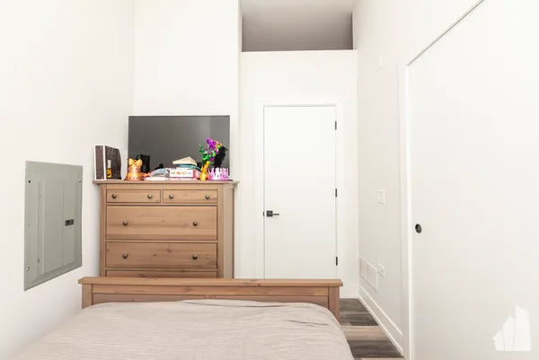 a view of a bedroom with cabinet