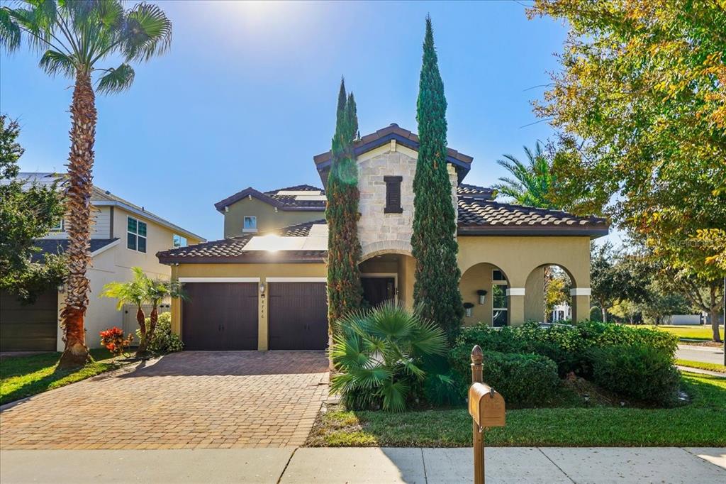 8746 Crescendo Avenue Windermere, FL 34786 - Photo 1 of 56 a house view with a garden space