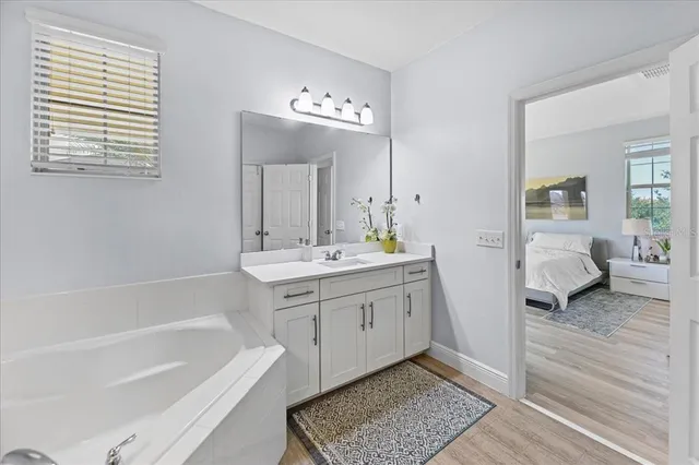 a utility room with sink dryer and washer