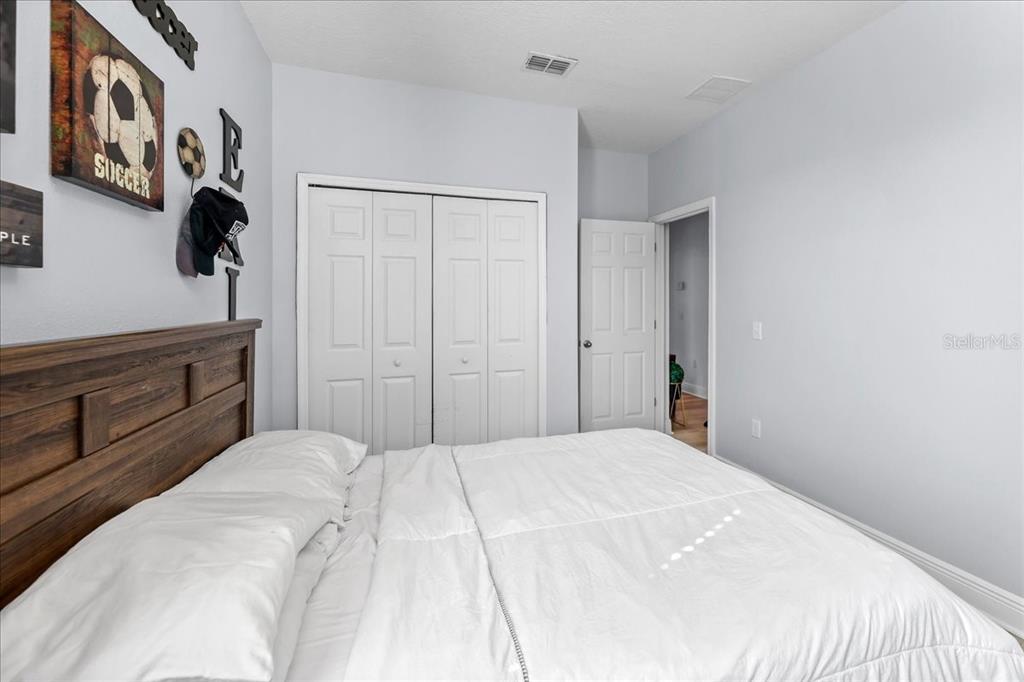 8746 Crescendo Avenue Windermere, FL 34786 - Photo 28 of 56 a bedroom with a bed and a cabinets