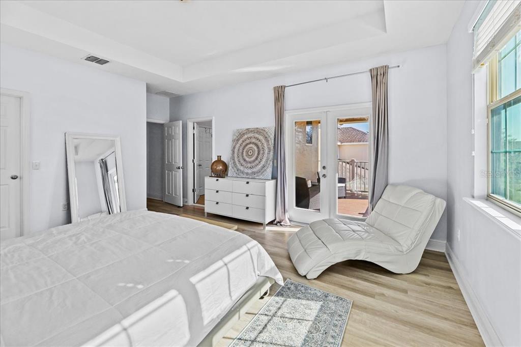 8746 Crescendo Avenue Windermere, FL 34786 - Photo 30 of 56 a spacious bedroom with a bed and a couch