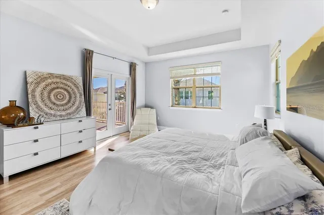 a spacious bathroom with a double vanity sink mirror and bathtub