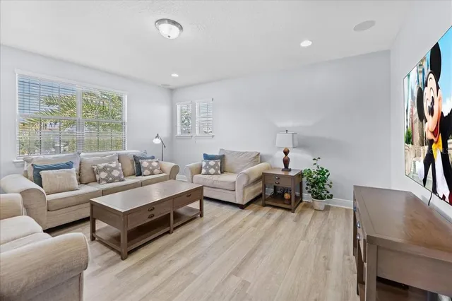 a bedroom with furniture and a chandelier