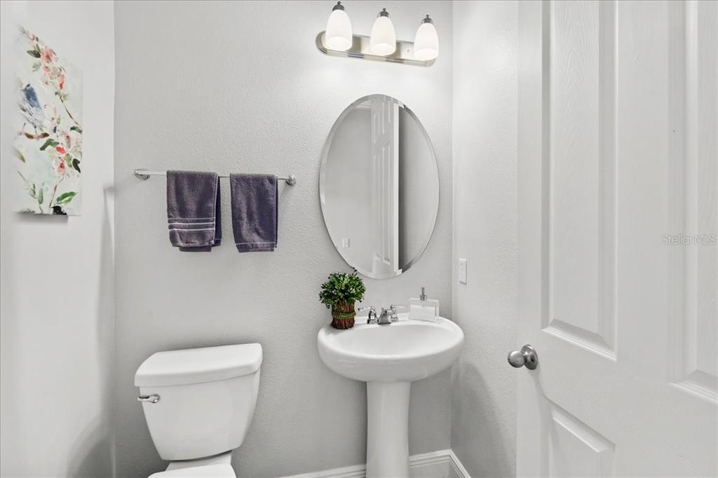 8746 Crescendo Avenue Windermere, FL 34786 - Photo 35 of 56 a bathroom with a toilet sink and mirror