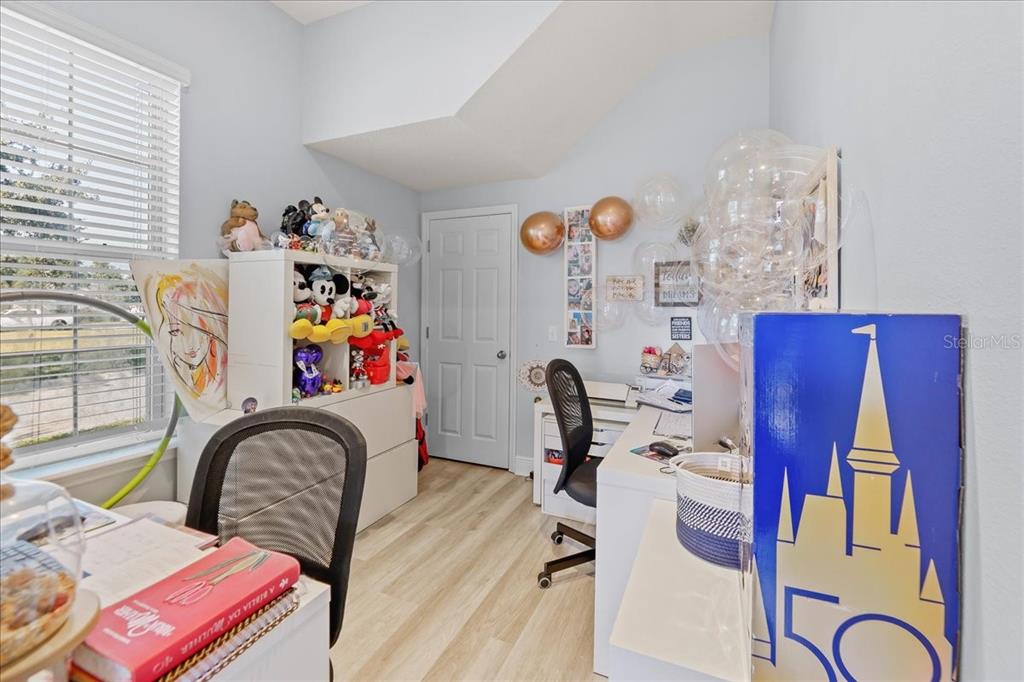 8746 Crescendo Avenue Windermere, FL 34786 - Photo 36 of 56 a bedroom with furniture and a chandelier