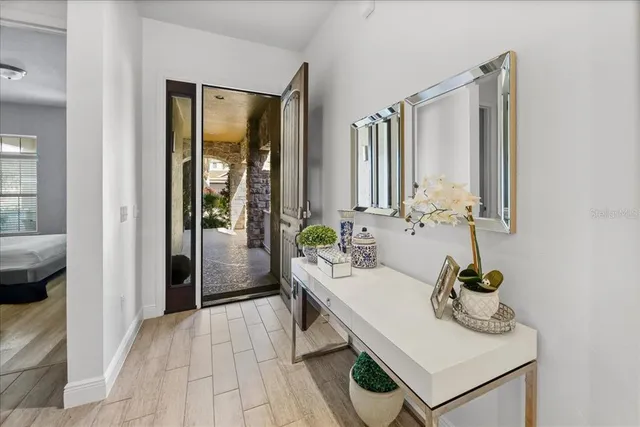 a spacious bedroom with a bed and cabinet