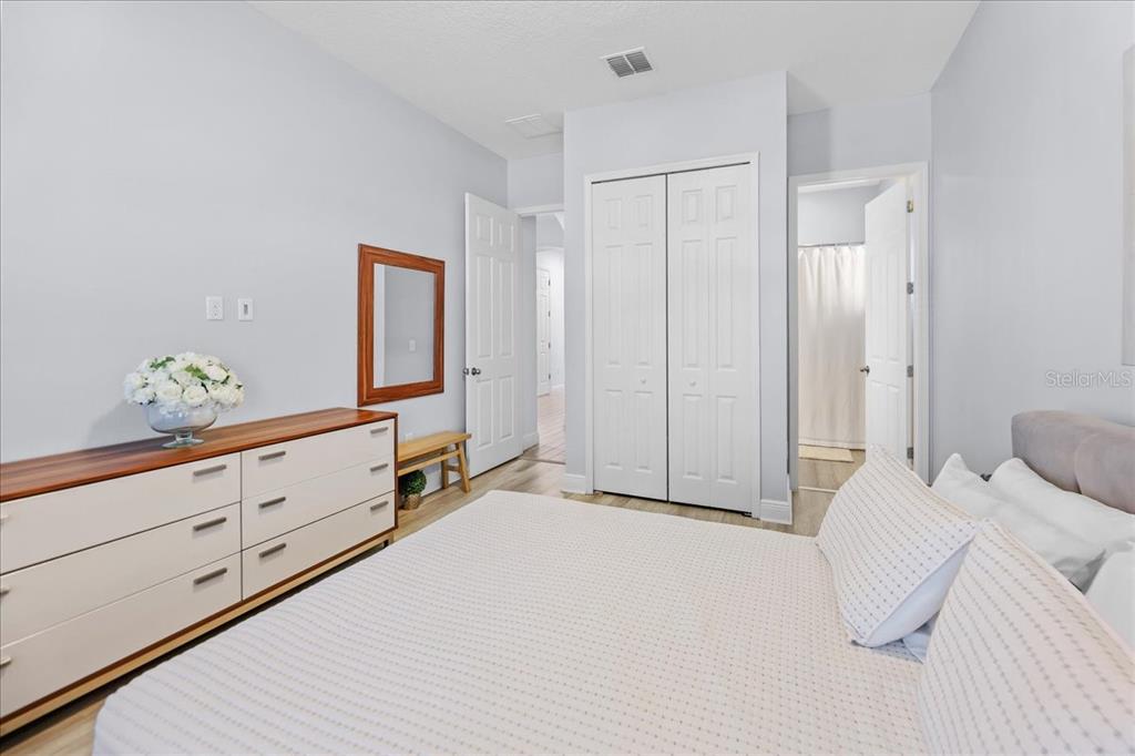 8746 Crescendo Avenue Windermere, FL 34786 - Photo 40 of 56 a spacious bedroom with a bed and cabinet