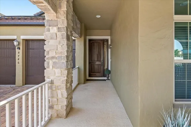 an aerial view of residential houses with outdoor space and street view