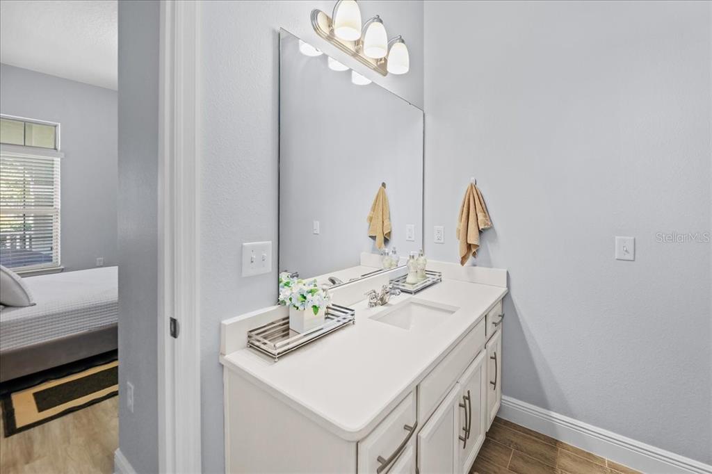 8746 Crescendo Avenue Windermere, FL 34786 - Photo 41 of 56 a bathroom with a sink vanity and a mirror