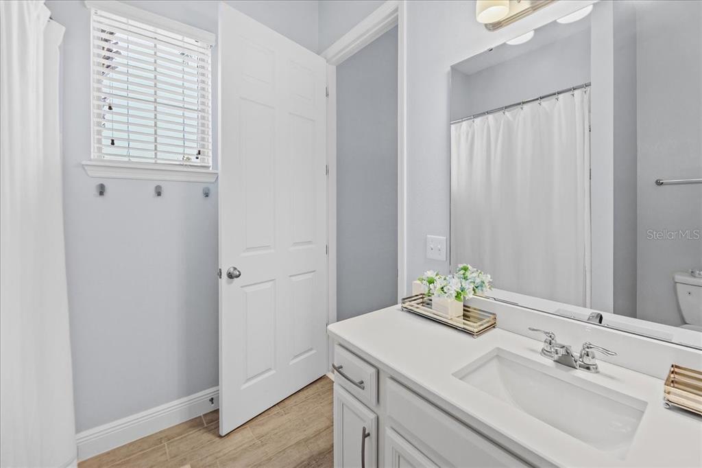 8746 Crescendo Avenue Windermere, FL 34786 - Photo 42 of 56 a bathroom with a sink and a mirror