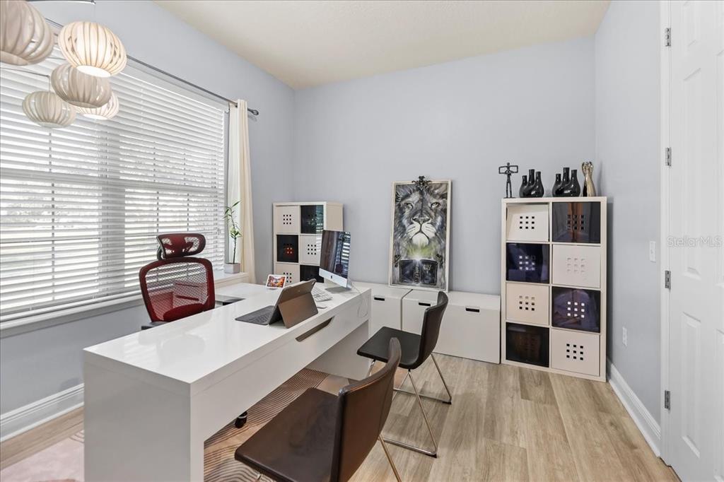 8746 Crescendo Avenue Windermere, FL 34786 - Photo 43 of 56 a view of a workspace with furniture and a window