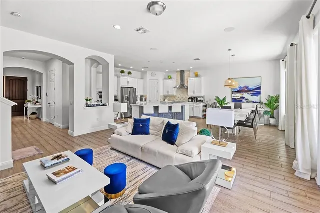 a view of a dining room with furniture window and wooden floor